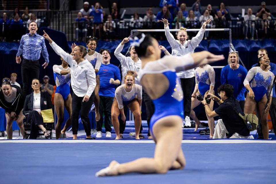 Florida Gators gymnasts cheer for Florida Gators gymnast Leanne Wong during her floor exercise against the LSU Tigers during the meet at Exactech Arena at the Stephen C. O'Connell Center in Gainesville, FL on Friday, February 23, 2024. [Matt Pendleton/Gainesville Sun]