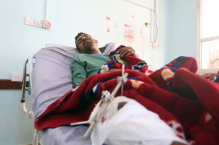 A man lies on a hospital bed after he was injured by a Katyusha missile strike by Houthis in the city of Marib, Yemen May 22, 2018. REUTERS/Ali Owidha