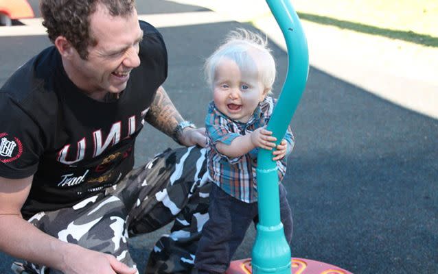 Nick Milne, pictured with Robbie, says he is amazed by the courage shown by his young, happy little boy. Photo supplied.