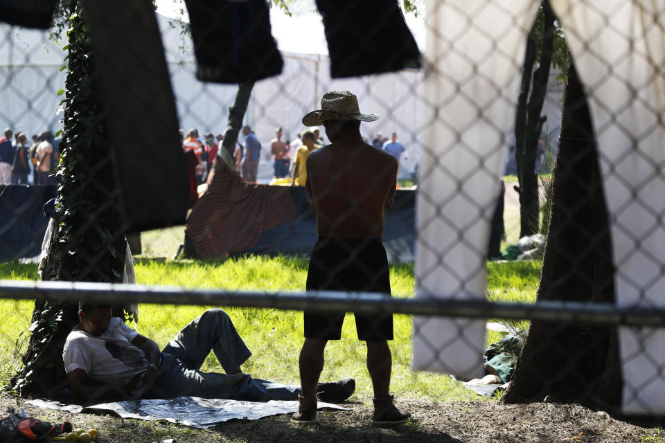 Central American migrants settle in a shelter at the Jesus Martinez stadium in Mexico City, Tuesday, Nov. 6, 2018. Humanitarian aid converged around the stadium in Mexico City where thousands of Central American migrants winding their way toward the United States were resting Tuesday after an arduous trek that has taken them through three countries in three weeks. (AP Photo/Marco Ugarte)