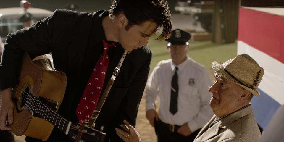 This image released by Warner Bros. Pictures shows Austin Butler and Tom Hanks in a scene from "Elvis." (Warner Bros. Pictures via AP)