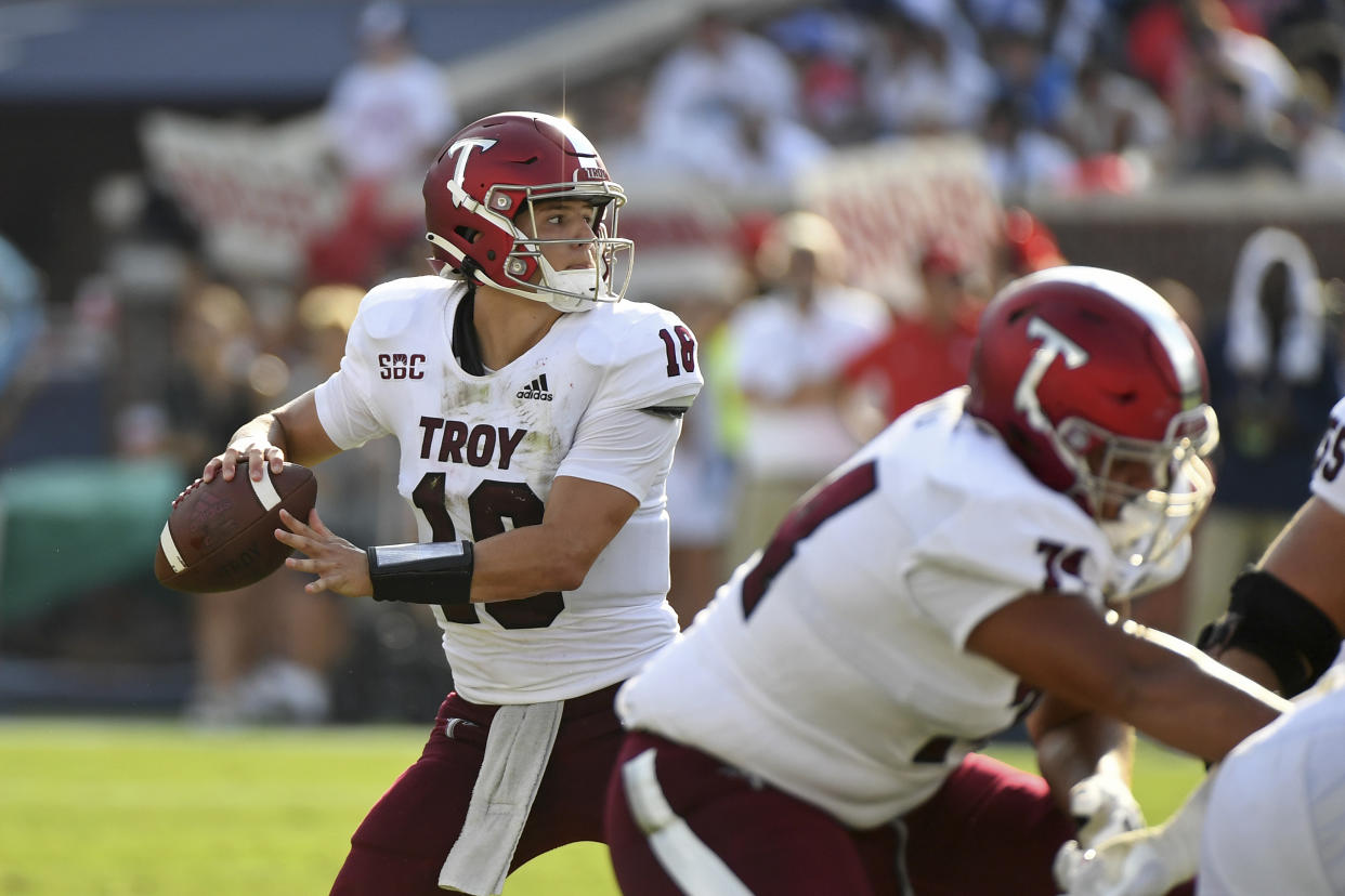 Troy quarterback Gunnar Watson (18) looks to pass during the second half an NCAA college football game against Mississippi in Oxford, Miss., Saturday, Sept. 3, 2022. Mississippi won 28-10. (AP Photo/Thomas Graning)