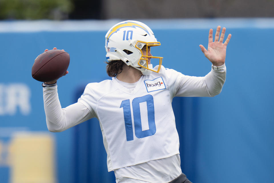 FILE - Los Angeles Chargers quarterback Justin Herbert (10) runs a drill during the NFL football team's camp Monday, May 22, 2023, in Costa Mesa, Calif. (AP Photo/Jae C. Hong, FIle)