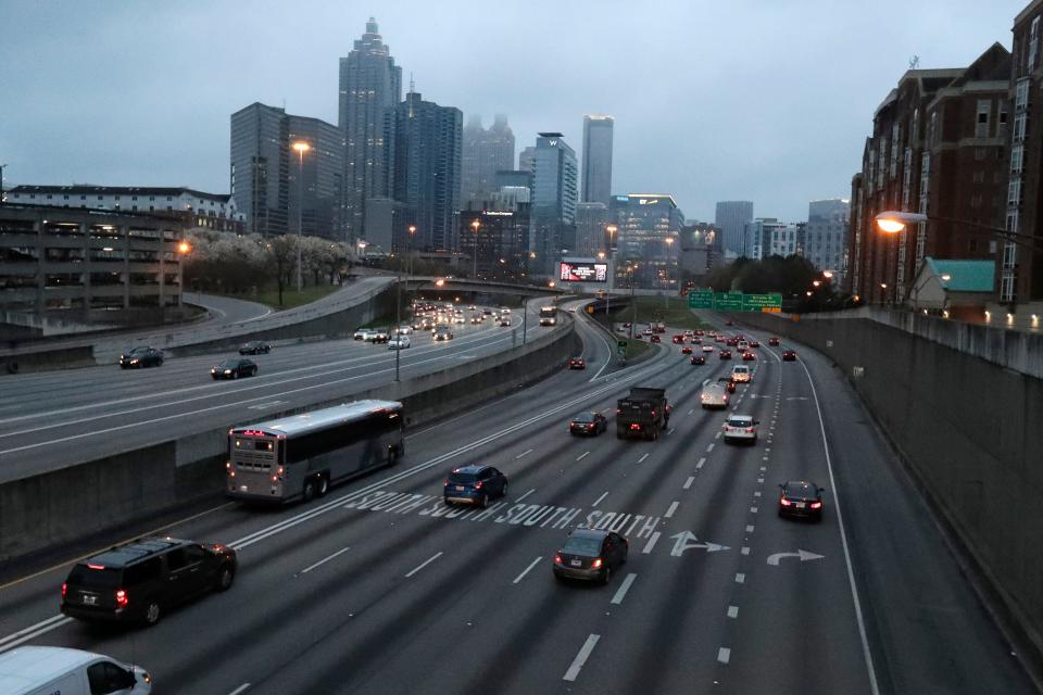 Lighter than normal early morning traffic moves in and out of downtown Atlanta Monday.