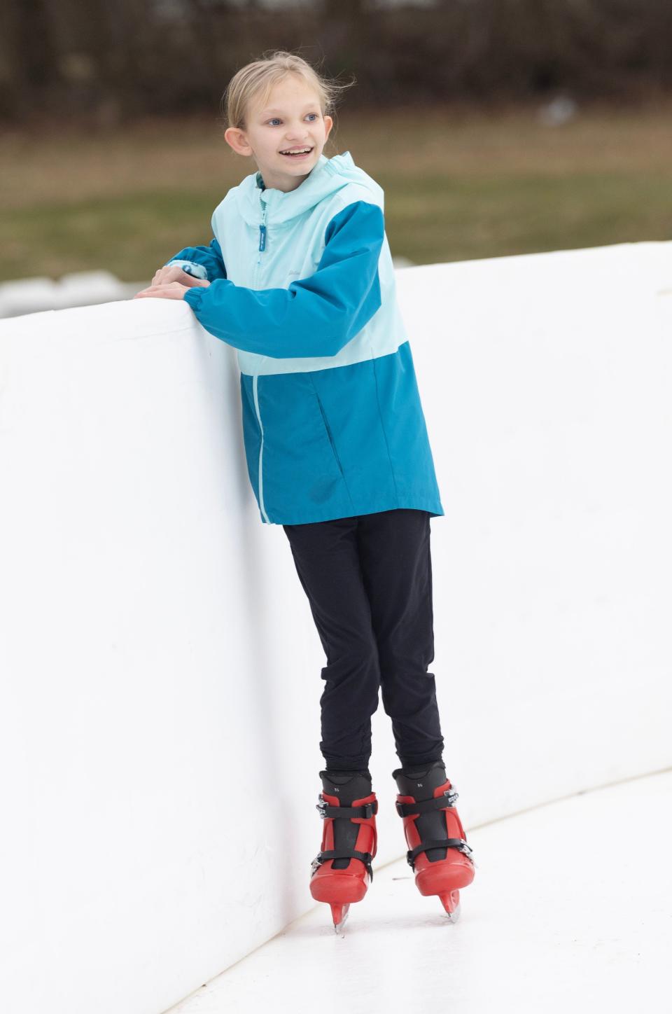 Bailey Hoffner, 11, of Massillon uses the side wall to hold her up as she learns to skate at Wampler Park in Massillon.