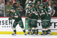 Minnesota Wild center Mason Shaw (15) celebrates his goal with teammates during the first period of an NHL hockey game against the Ottawa Senators Tuesday, April 2, 2024, in St. Paul, Minn. (AP Photo/Matt Krohn)