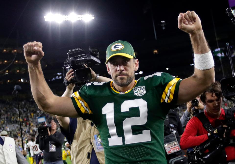 Green Bay Packers quarterback Aaron Rodgers (12) celebrates a 24-23 victory against the Chicago Bears at Lambeau Field.