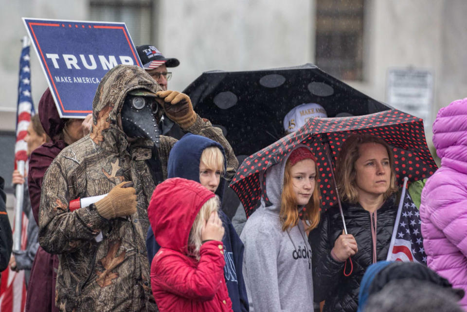 <div class="inline-image__caption"><p>Plague-doctor masked man in fatigues with family. (Stop the Steal rally, Salem, Ore., Nov 7, 2020)</p></div> <div class="inline-image__credit">Jeff Schwilk</div>