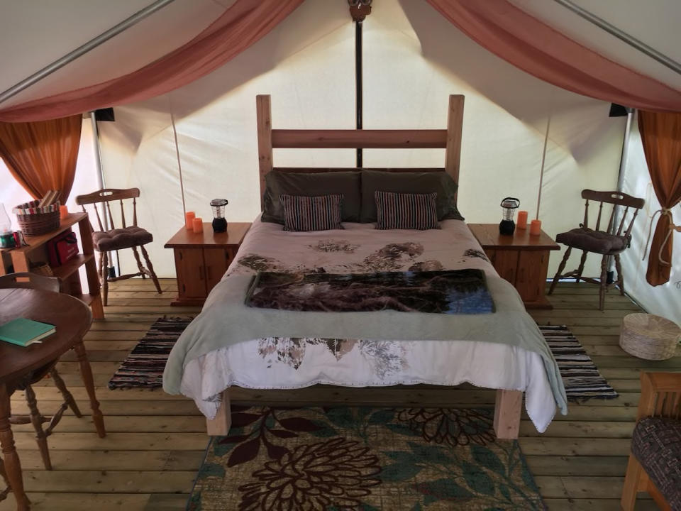 <p>This isn’t any ordinary tent, though. You’ll be “glamping,” sleeping in a handmade queen bed. (Airbnb) </p>