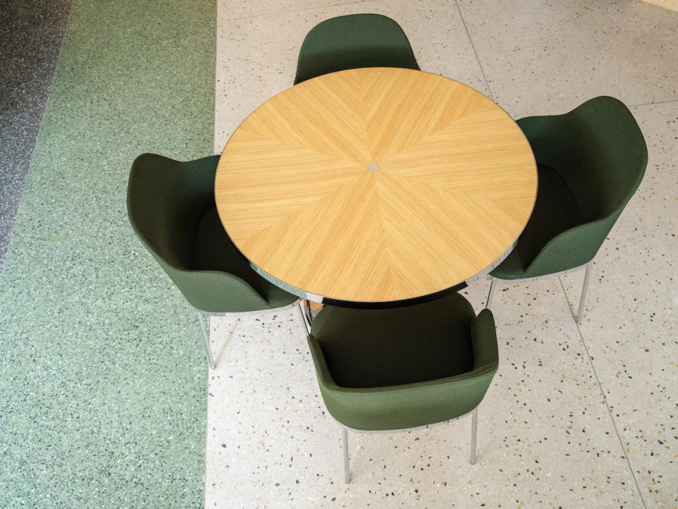 Overhead view of a dining table and chairs inside Copenhagen's Restaurant Levi.