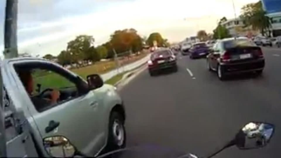 The motorcyclist can be seen quickly overtaking the ute. Source: Facebook