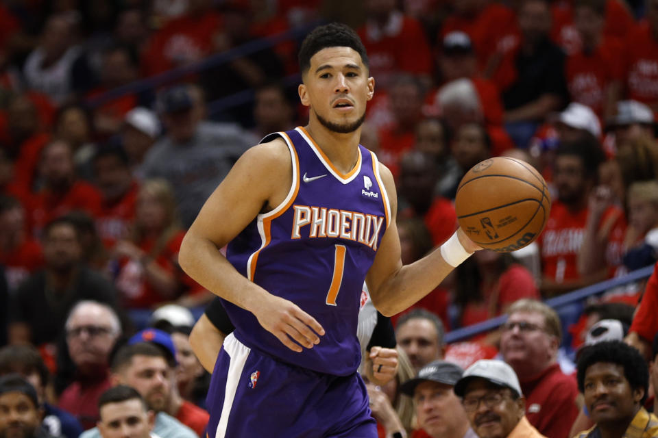 NEW ORLEANS, LOUISIANA - APRIL 28: Devin Booker #1 of the Phoenix Suns drives the ball up the court against the New Orleans Pelicans at Smoothie King Center on April 28, 2022 in New Orleans, Louisiana.  NOTE TO USER: User expressly acknowledges and agrees that, by downloading and or using this Photograph, user is consenting to the terms and conditions of the Getty Images License Agreement.  (Photo by Chris Graythen/Getty Images)