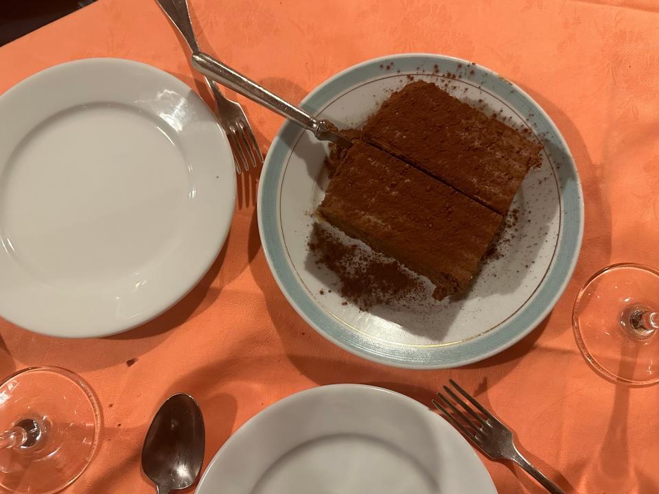 Chocolate dessert on plate with two plats and forks for sharing 