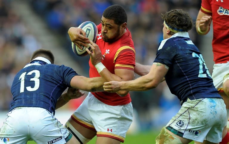 Wales' Taulupe Faletau (C) vies with Scotland's center Huw Jones (L) and Scotland's Hamish Watson during the Six Nations international rugby union match Febuary 25, 2017