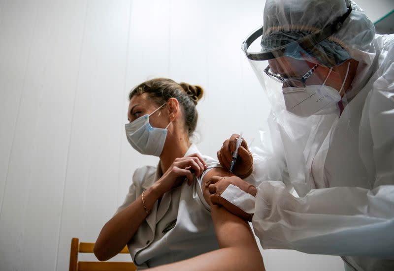 FILE PHOTO: A medic of the regional hospital receives Russia's "Sputnik-V" vaccine shot against the coronavirus disease (COVID-19) in Tver