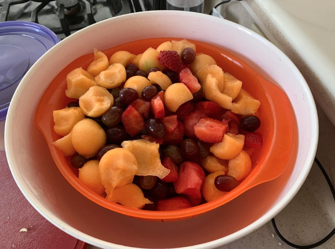 Fruit in a strainer in a bowl