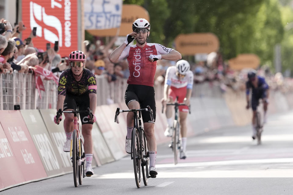 France's Benjamin Thomas celebrates winning the fifth stage of the Giro d'Italia, Tour of Italy cycling race, from Genoa to Lucca, Wednesday, May 8, 2024. (Massimo Paolone/LaPresse via AP)
