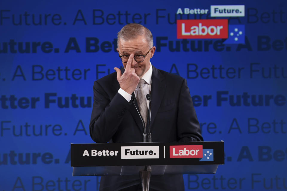 Australian opposition leader Anthony Albanese adjusts his glasses as he addresses the crowd during the Labor Party campaign launch in Perth, Sunday, May 1, 2022. Australia will have a national election on May 21. (Lukas Coch/AAP Image via AP)