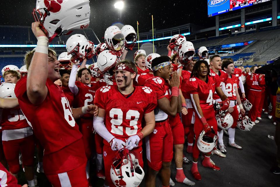 The Beechwood Tigers celebrate their victory in the KHSAA Class 2A state title game with Mayfield Friday, Dec. 2, 2022.