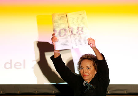 Elba Esther Gordillo, Mexico's teachers union former leader, shows her release document while talking publicly for the first time since she was cleared of charges for laundering $104 million of funds from the union, in Mexico city, Mexico August 20, 2018. REUTERS/Gustavo Graf