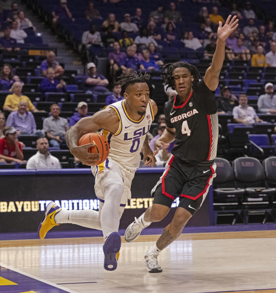 LSU guard Trae Hannibal (0) drives against Georgia guard Silas Demary Jr. (4) during an NCAA college basketball game Tuesday, Feb. 27, 2024, in Baton Rouge, La. (Hilary Scheinuk/The Advocate via AP)