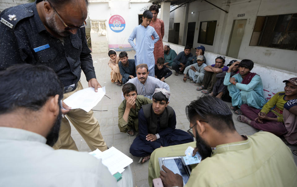 Immigrants, mostly Afghans, go through data verification process at a counter of Pakistan's National Database and Registration Authority in Karachi, Pakistan, Friday, Nov. 17, 2023. The U.N. health agency is warning that about 1.3 million Afghans are expected to return to Afghanistan from Pakistan where authorities earlier are expelling foreigners, mostly Afghans, living in the country illegally. It had forced at least 340,000 Afghans to leave Pakistan after spending decades, officials said Friday. (AP Photo/Fareed Khan)