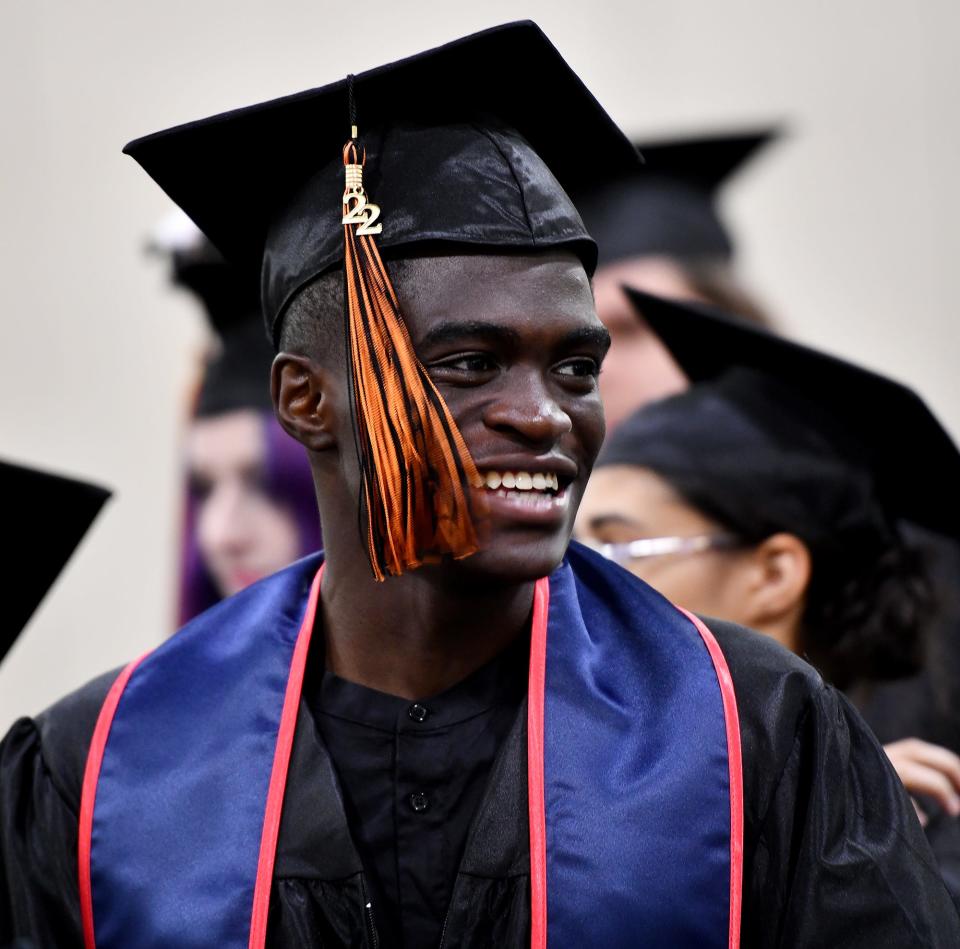 WORCESTER - Kofi Somiah is all smiles as North High School graduates line up for procession for commencement at the DCU Center Wednesday, June 8, 2022.