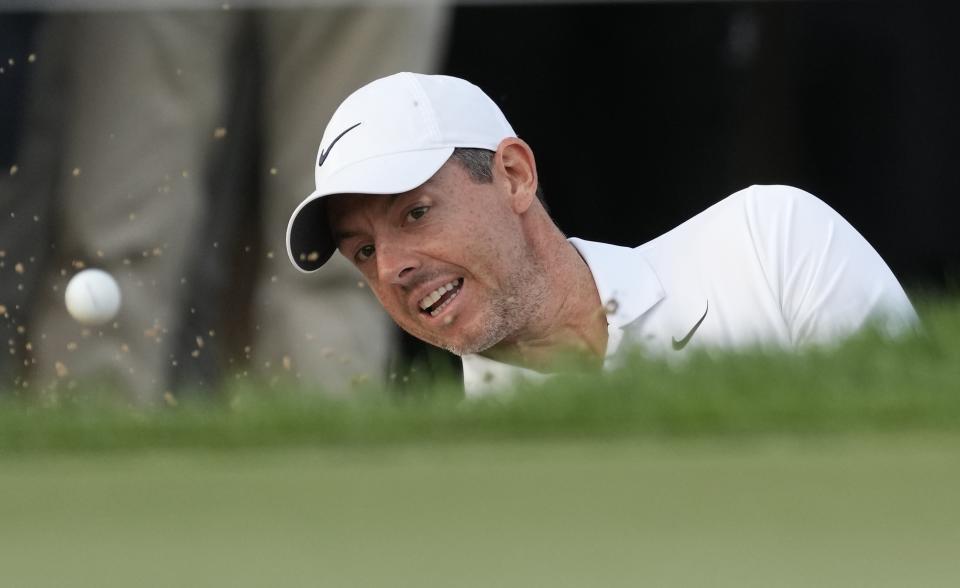 Rory McIlroy of Northern Ireland plays a bunker shot on 10th hole during the first round of the Hero Dubai Desert Classic golf tournament, in Dubai, United Arab Emirates, Thursday, Jan. 18, 2024. (AP Photo/Kamran Jebreili)