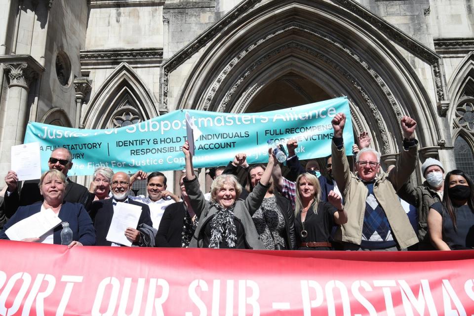 Sub-postmasters celebrate the high court ruling in 2019 which led to 39 having their convictions quashed (PA)
