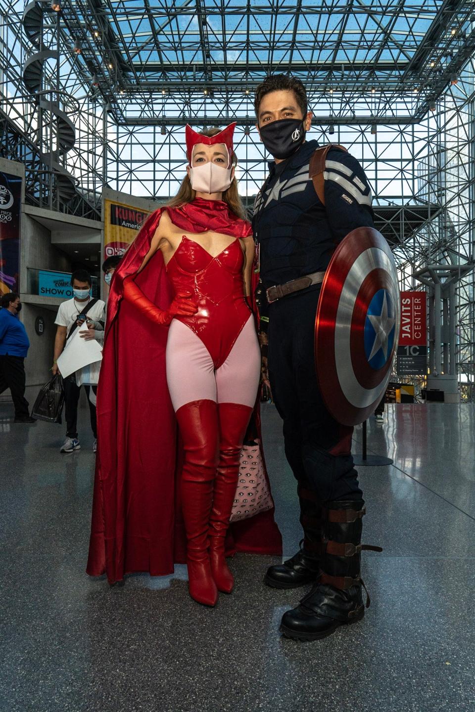 Two cosplayers dressed as Scarlet Witch and Captain America at New York Comic Con 2021.