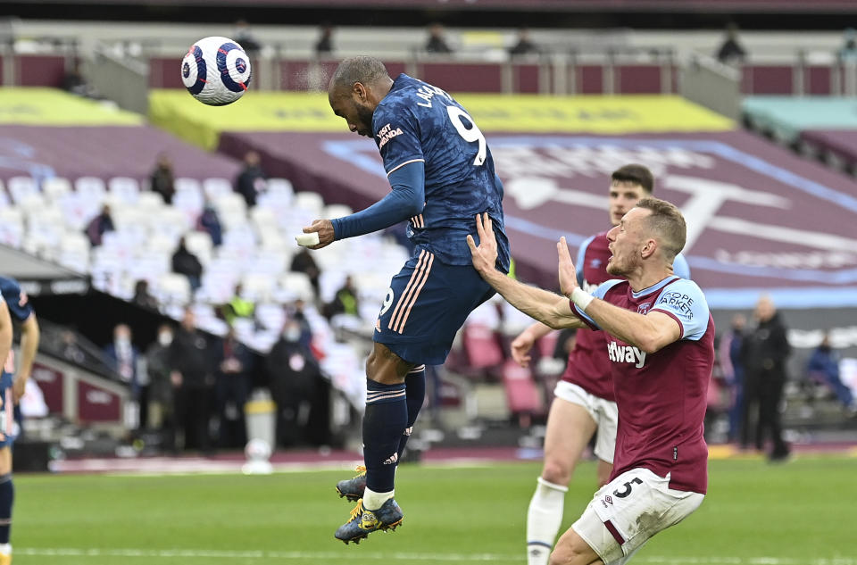 Arsenal's Alexandre Lacazette scores his side's third goal during the English Premier League soccer match between West Ham United and Arsenal at the London Stadium in London, England, Sunday, March 21, 2021. (Justin Tallis, Pool via AP)