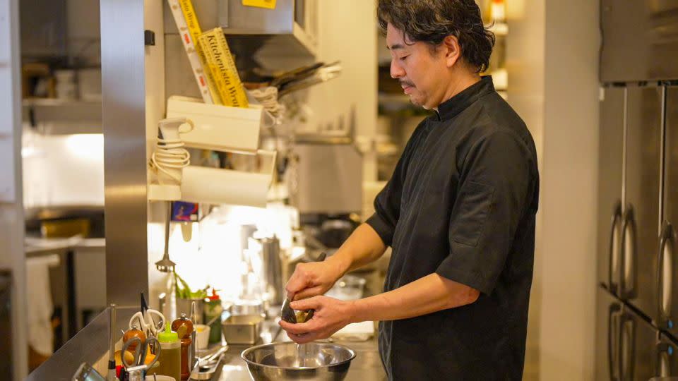 Chef Tomoyuki Takao in the kitchen of his eponymous Hokkaido restaurant. - CNN
