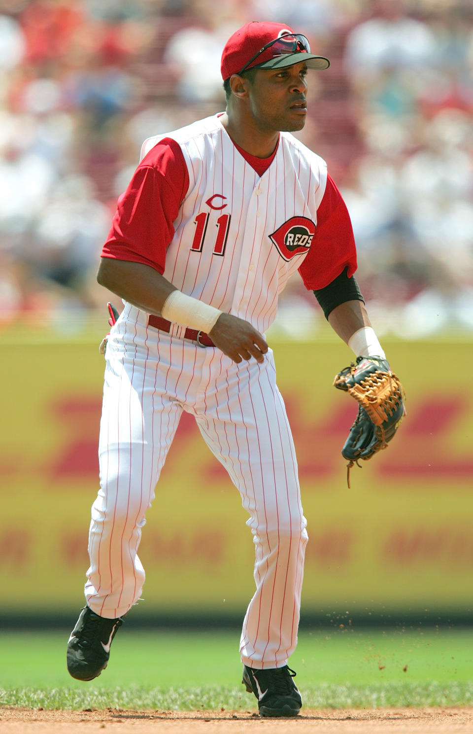 Barry Larkin of the Cincinnati Reds focuses on home plate as he prepares for a play during the interleague game against the Texas Rangers at the Great American Ball Park on June 17, 2004 in Cincinnati, Ohio. Larkin was elected to the Baseball Hall of Fame January 9, 2012. (Photo by Matthew Stockman/Getty Images)