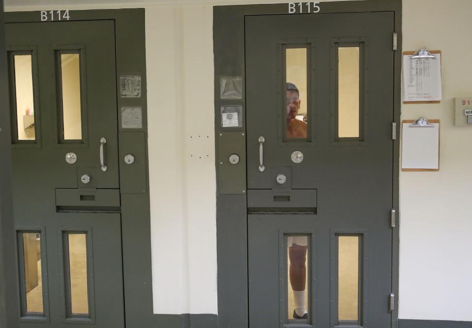 A detainee stares out of his cell in the segregation unit at the U.S. Immigration and Customs Enforcement's (ICE) Adelanto processing Center in Adelanto, Calif, on Dec. 3, 2019.