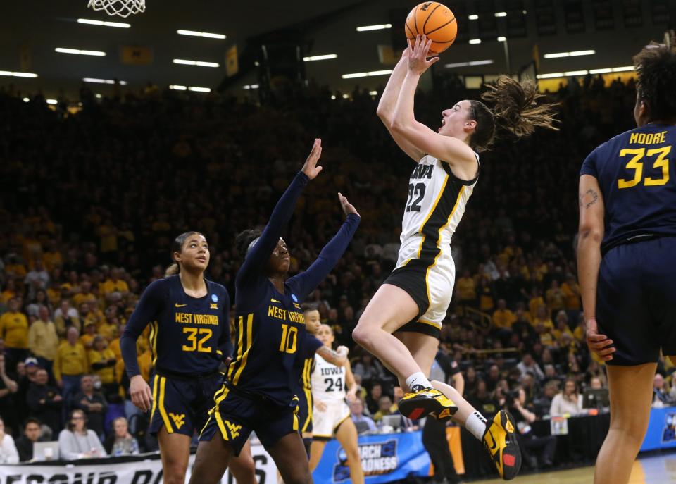 Caitlin Clark (22) shoots against West Virginia in a NCAA Tournament round of 32 game Monday, March 25, 2024 at Carver-Hawkeye Arena.