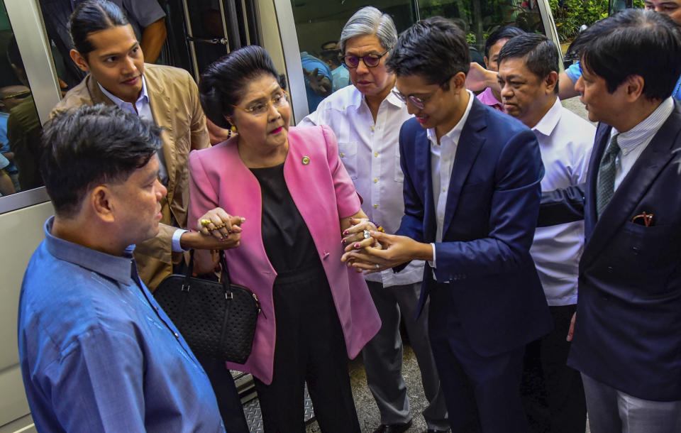 Former Philippine First Lady Imelda Marcos arrives at an anti-graft court Sandiganbayan to explain her side for not attending last week's promulgation of the graft charges against her Friday, Nov. 16, 2018 in suburban Quezon city northeast of Manila, Philippines. A Philippine court found Imelda Marcos guilty of graft and ordered her arrest last week in a rare conviction among many corruption cases that she's likely to appeal to avoid jail and losing her seat in Congress. (AP Photo/Maria S. Tan)