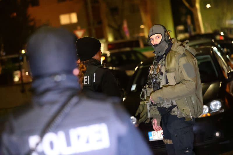 German special forces prepare to search an area after a shooting in Hanau near Frankfurt