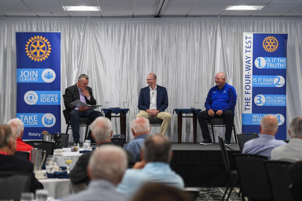 USD Senior Associate AD for Facilities & Operations Corey Jenkins and SDSU Athletic Director Justin Sell discuss with Rotarian Joel Dykstra on topics about the changing landscape in college athletics at the Holiday Inn Sioux Falls City Centre on Monday, July 31, 2023.