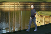 Dustin Johnson walks off the green on the 17th hole during the first round of the The Players Championship golf tournament Thursday, March 11, 2021, in Ponte Vedra Beach, Fla. (AP Photo/John Raoux)