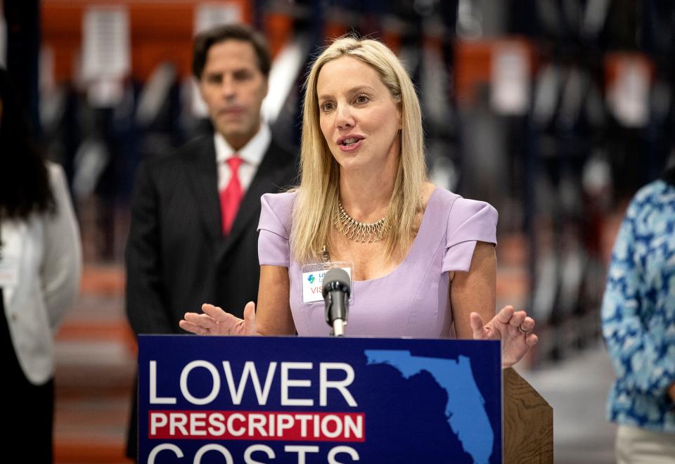 Julie Imanuel Brown, Secretary of the Florida Department of Business and Professional Regulation, speaks alongside Gov. Ron DeSantis in May in Lakeland at a drug costs press conference.