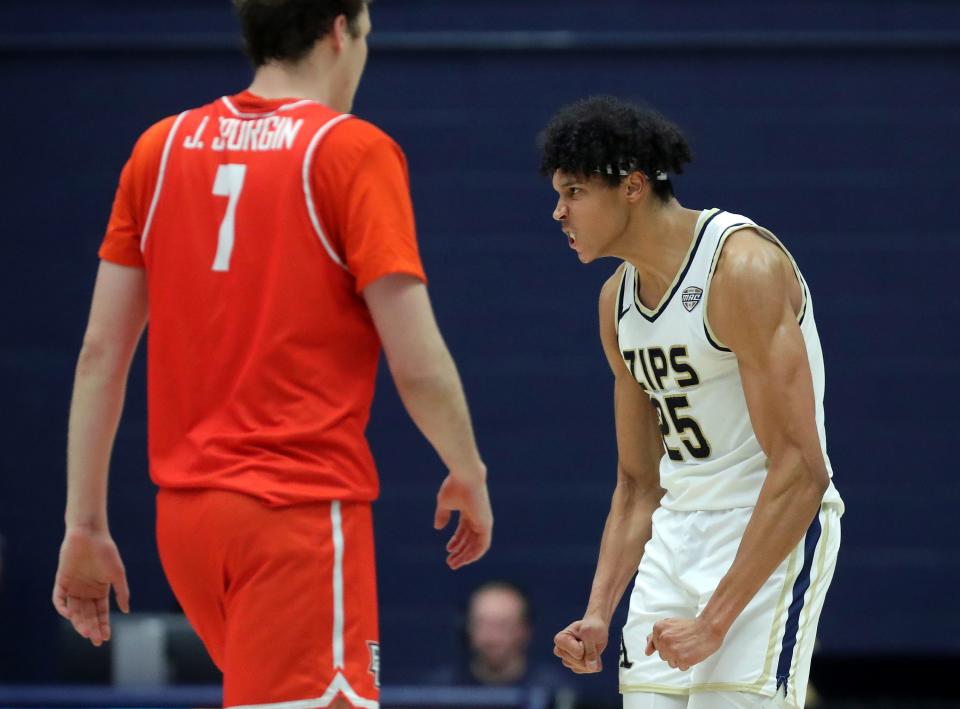 Akron's Enrique Freeman (25) celebrates after his dunk against Bowling Green on Jan. 5 in Akron.