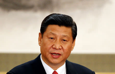 FILE PHOTO - Newly-elected General Secretary of the Central Committee of the Communist Party of China (CPC) Xi Jinping speaks as he meets with the press at the Great Hall of the People in Beijing, November 15, 2012. REUTERS/Carlos Barria/File Photo