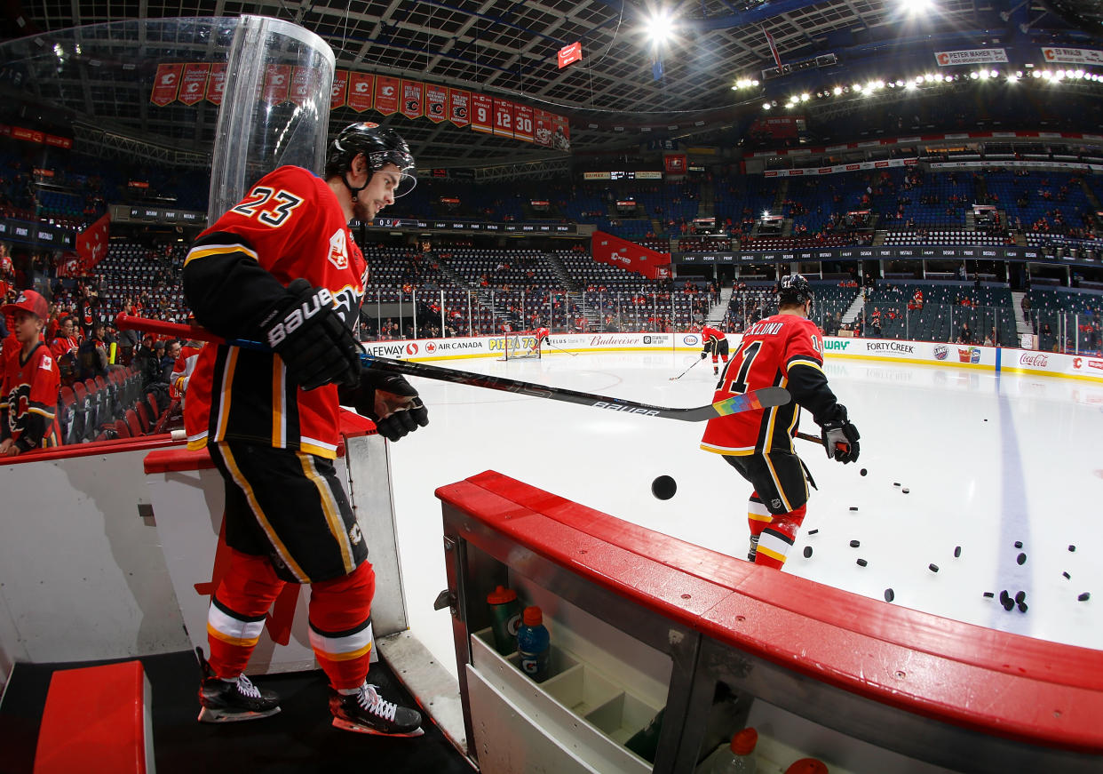 CALGARY, AB - MARCH 6: Sean Monahan #23 of the Calgary Flames heads out on to the ice for warm up against the Arizona Coyotes at Scotiabank Saddledome on March 6, 2020 in Calgary, Alberta, Canada. (Photo by Gerry Thomas/NHLI via Getty Images)