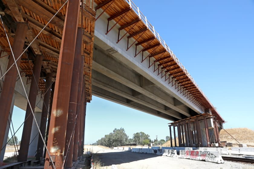 MADERA, CA - AUGUST 05: A 700 foot bullet train bridge across Road 27, between Road 27 and Club Dr., and the BNSF main line in Madera County had a serious problem with corroded tension strands that broke in December 2019, on Wednesday, Aug. 5, 2020 in Madera, CA. The California High-Speed Rail Authority is making repairs, though the incident points to seriously underlying problems in the project's management. After the strands (steel cables) broke, construction teams shored up the bridge with falsework. (Gary Coronado / Los Angeles Times)