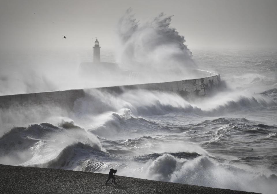 Strong winds in the English Channel cause huge waves over Newhaven Harbor Lighthouse.