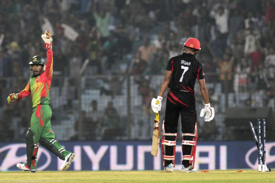 Bangladesh's captain Mushfiqur Rahim, left appeals successfully for the dismissal of Hong Kong's Irfan Ahmed during their ICC Twenty20 Cricket World Cup match in Chittagong, Bangladesh, Thursday, March 20, 2014 . (AP Photo/Bikas Das)