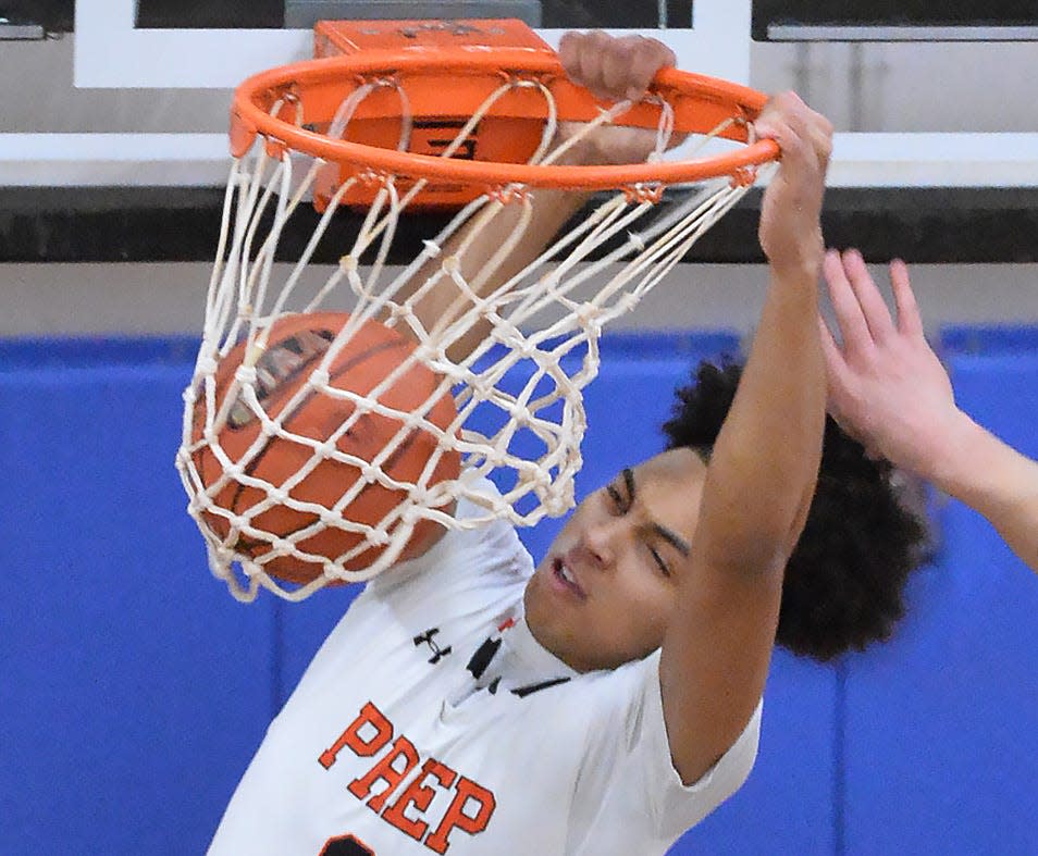 Cathedral Prep's Zion Barksdale dunks against Fort LeBoeuf during Friday's boys basketball game at the Joann Mullen Gymnasium.