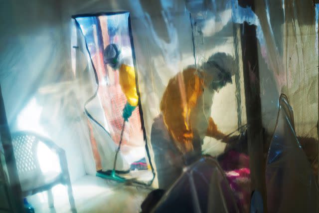 <p>AP Photo/Jerome Delay</p> Health workers in an Ebola isolation tent in Beni, DRC Congo, July 13, 2019.