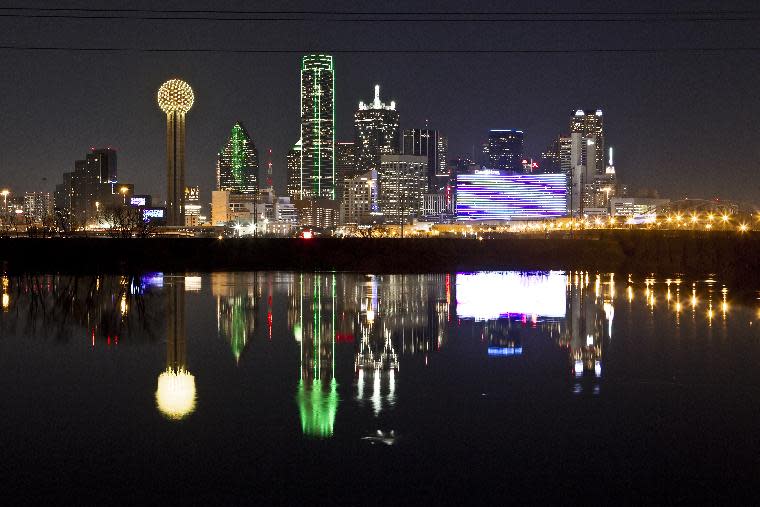 In this Thursday, Jan. 26, 2012 file photo, the Dallas skyline is reflected in the Trinity River in Dallas. (AP Photo/Brandon Wade)