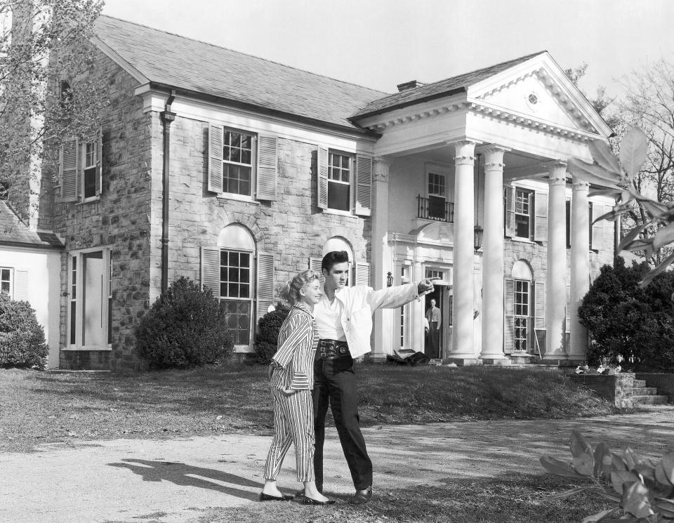 FILE - Elvis Presley with his girlfriend, Yvonne Lime, are photographed at his home, Graceland, in Memphis, Tenn., around 1957. The Tennessee attorney general's office said Tuesday, June 25, 2024, that it has turned over its investigation into the failed sale of Presley’s home Graceland at a foreclosure auction to federal authorities, a newspaper reported. (AP Photo, File)